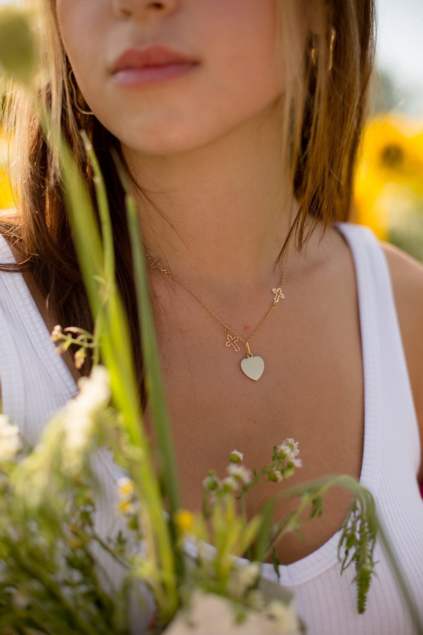 Chain necklace worn at the collar