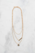 Small locket on a fine chain, on marble