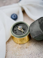 Open band ring on white marble