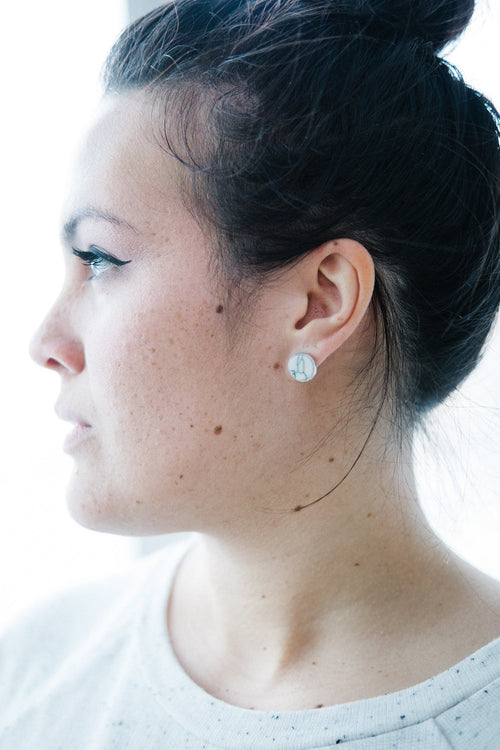 Earrings shown close up