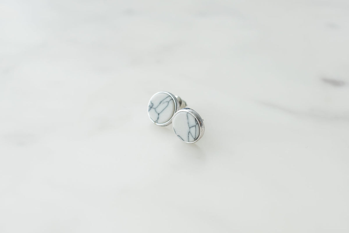 Pearl stud earrings on white