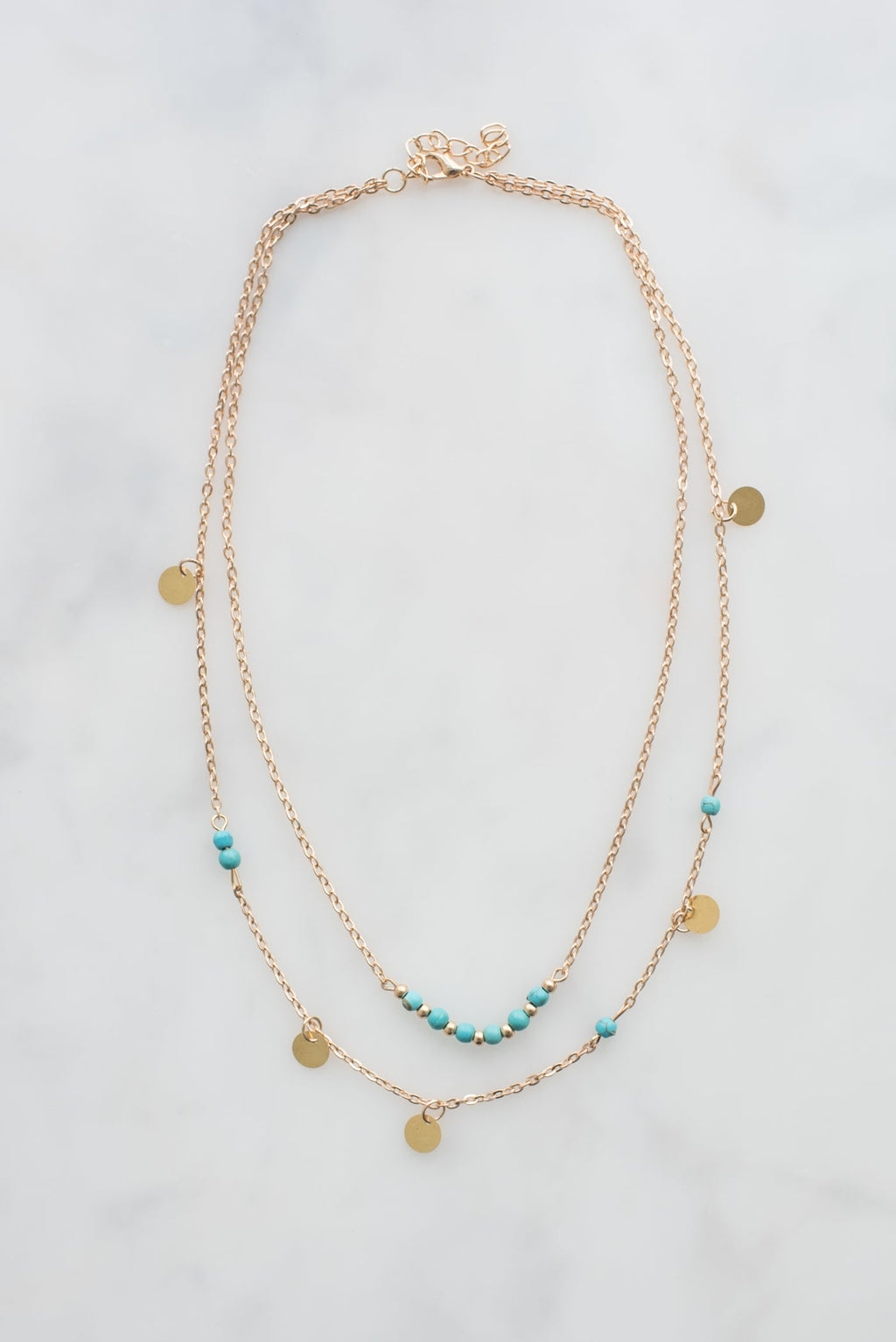 Flat link chain necklace on marble