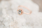 Open band ring on white marble